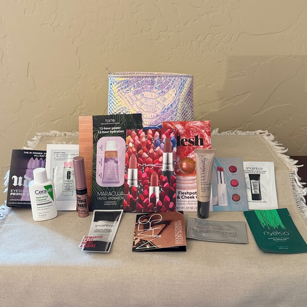 Holographic snake embossed case with samples/travel size skin care & makeup.